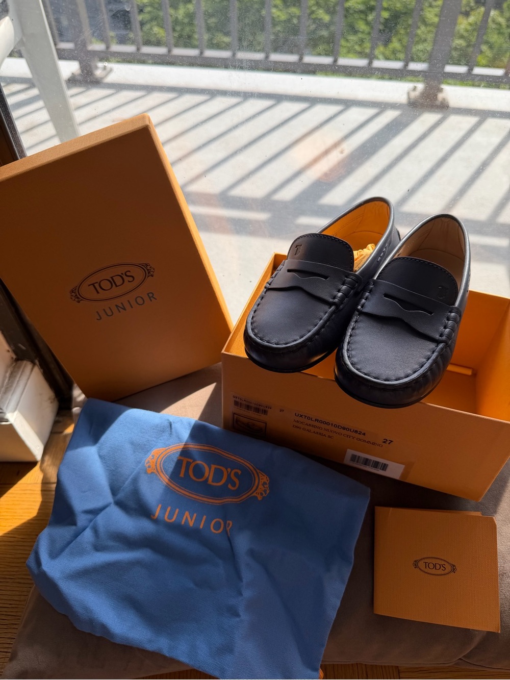 Tod's Black Leather Penny Loafers with Rubber Gommino Sole